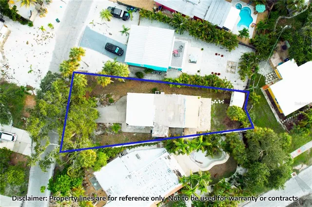 an aerial view of a house with a swimming pool yard and outdoor seating