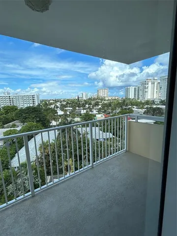 a bed sitting in a room next to a window