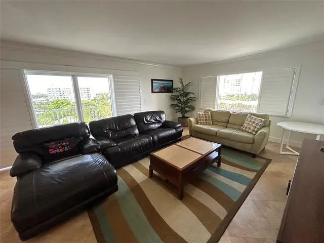 a bedroom with furniture and window