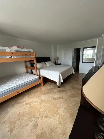 a bathroom with a granite countertop sink a toilet and a mirror