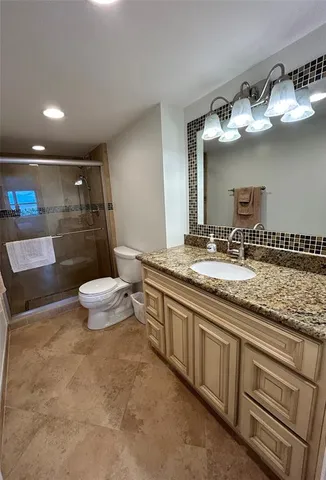 a kitchen with a sink stove and a refrigerator