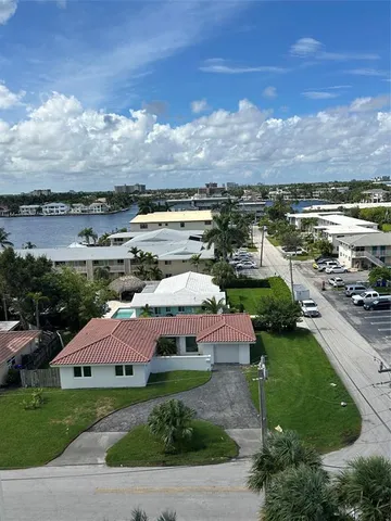 a kitchen with stainless steel appliances kitchen island granite countertop a stove sink and cabinets