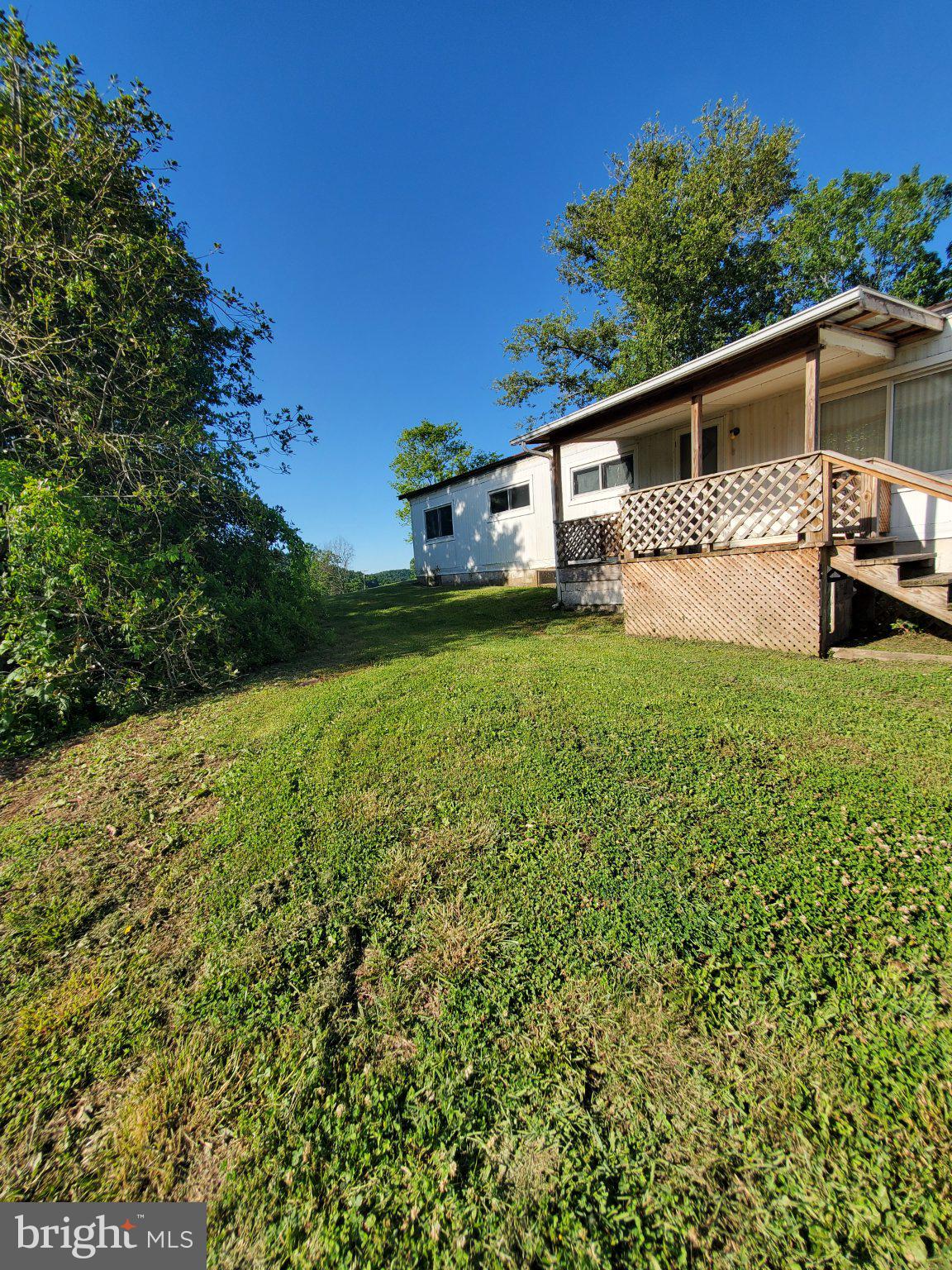 7881 Ford Hill Road Rio, WV 26755 - Photo 18 of 27 Charming hillside retreat with greenery.