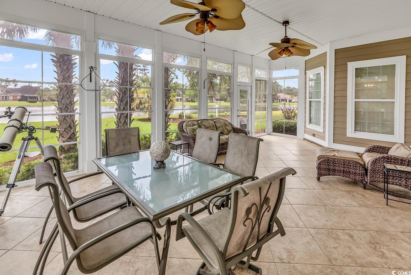 7029 Byrnes Lane Myrtle Beach, SC 29588 - Photo 15 of 40 Sunroom / solarium with outdoor dining space, ceiling fan, and plenty of natural light