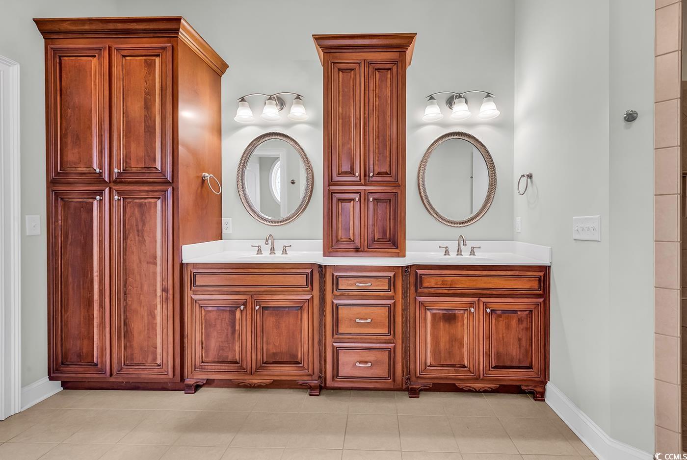 7029 Byrnes Lane Myrtle Beach, SC 29588 - Photo 23 of 40 Bathroom with double vanity and tile patterned flooring
