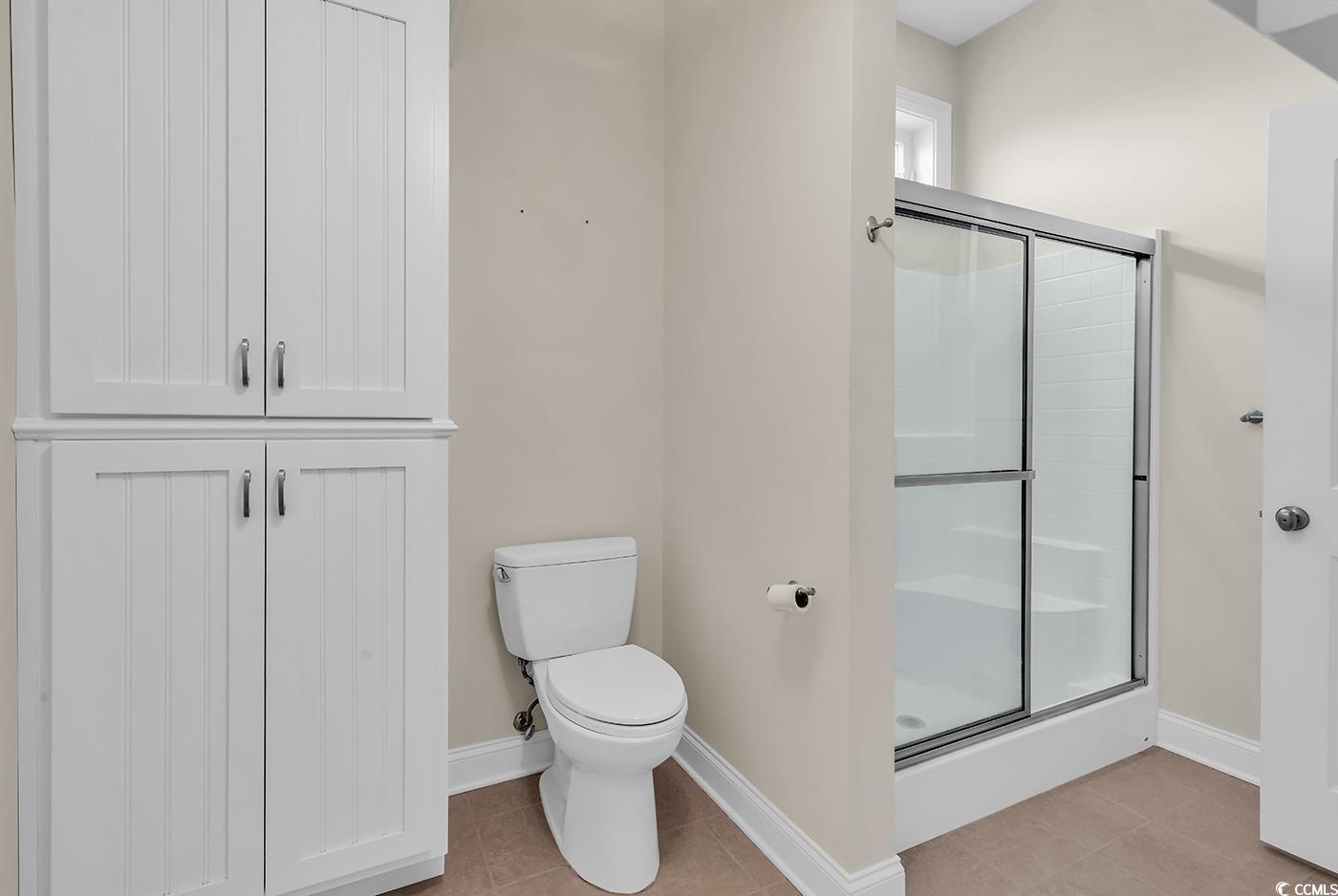 7029 Byrnes Lane Myrtle Beach, SC 29588 - Photo 26 of 40 Bathroom featuring a stall shower and tile patterned floors