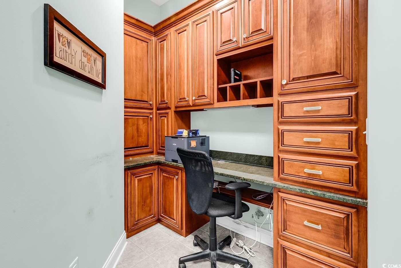 7029 Byrnes Lane Myrtle Beach, SC 29588 - Photo 30 of 40 Home office with built in desk and light tile patterned flooring