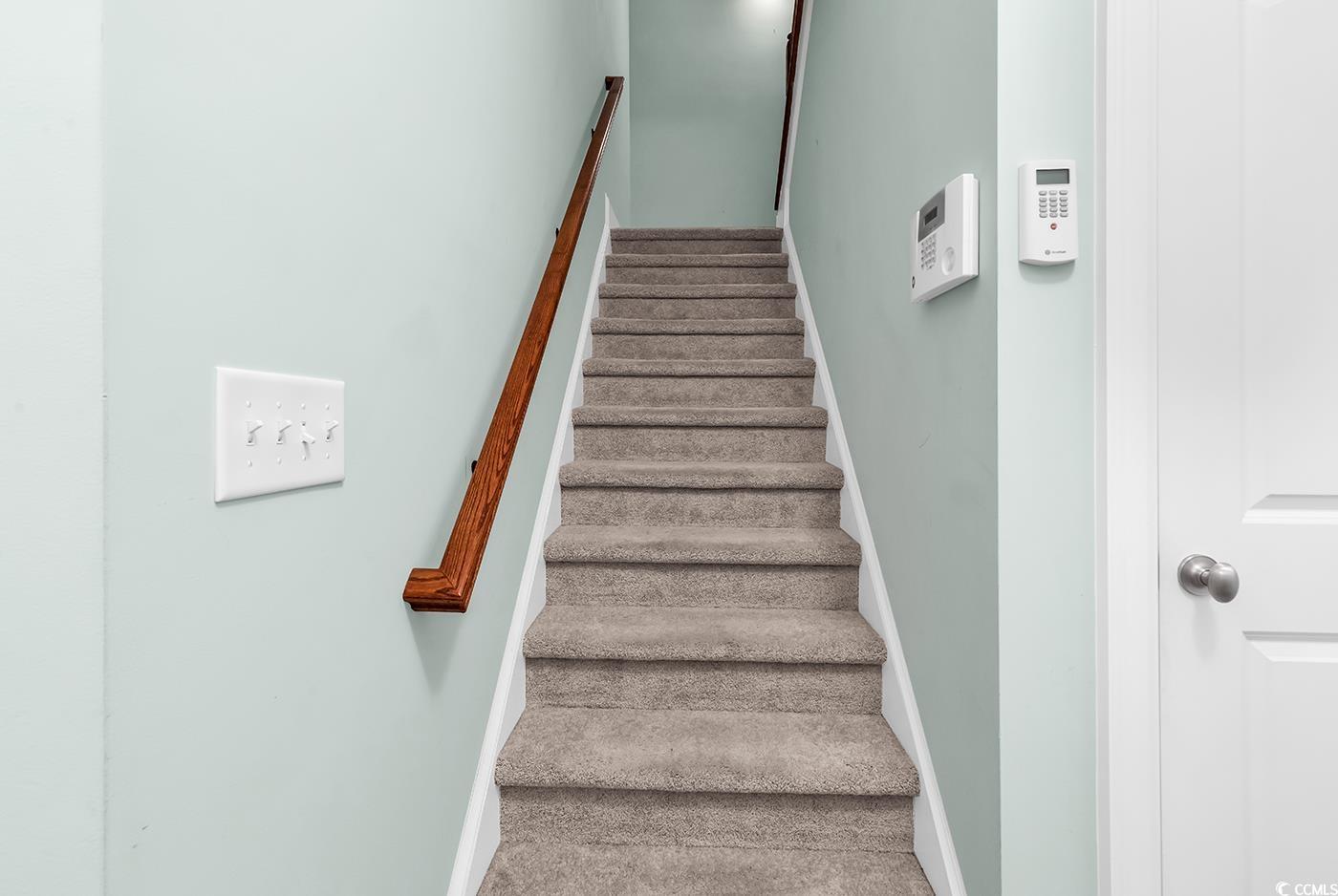 7029 Byrnes Lane Myrtle Beach, SC 29588 - Photo 31 of 40 Staircase featuring baseboards