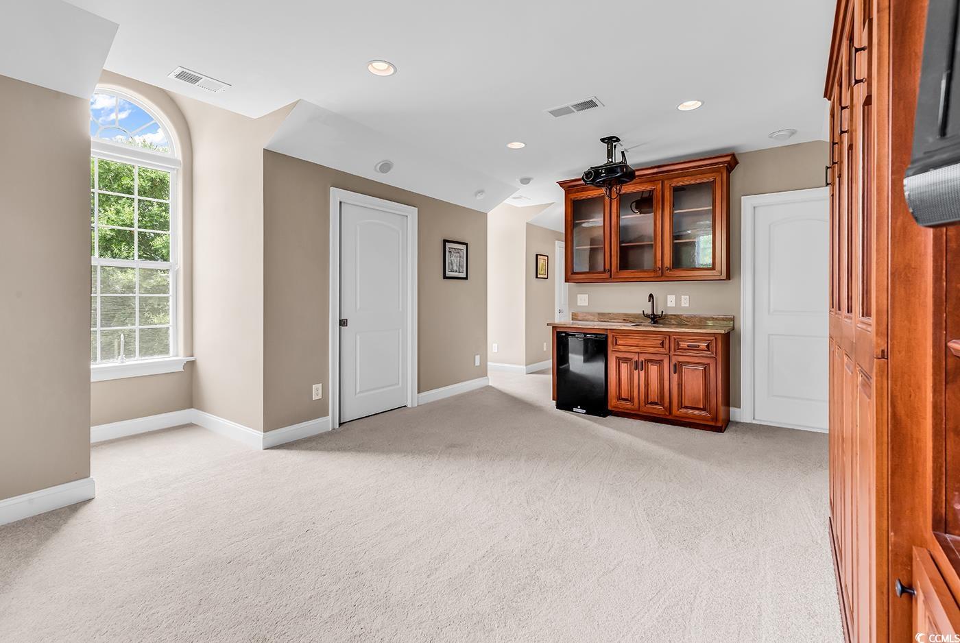 7029 Byrnes Lane Myrtle Beach, SC 29588 - Photo 33 of 40 Indoor wet bar with light carpet, recessed lighting, and dishwasher