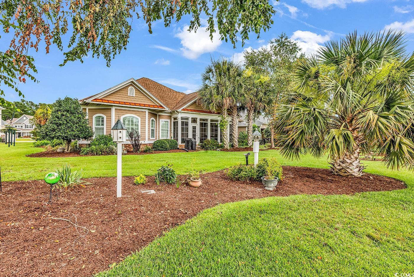 7029 Byrnes Lane Myrtle Beach, SC 29588 - Photo 35 of 40 View of back of property with a back lawn