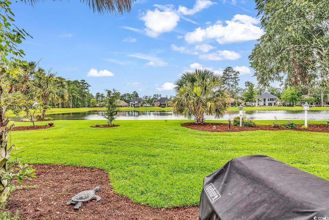 7029 Byrnes Lane Myrtle Beach, SC 29588 - Photo 36 of 40 Surrounding community featuring a water view and a lawn