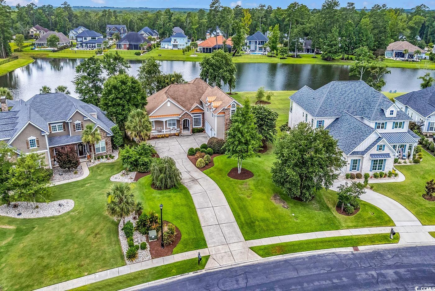 7029 Byrnes Lane Myrtle Beach, SC 29588 - Photo 37 of 40 Aerial view of residential area featuring a large body of water