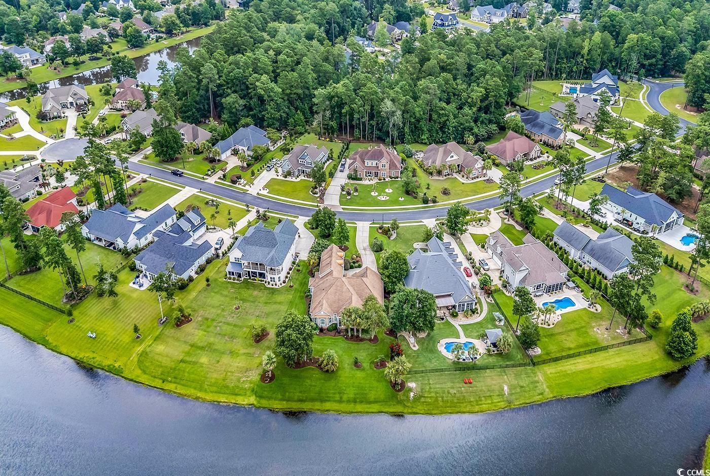 7029 Byrnes Lane Myrtle Beach, SC 29588 - Photo 39 of 40 Aerial view of property and surrounding area with a large body of water and nearby suburban area