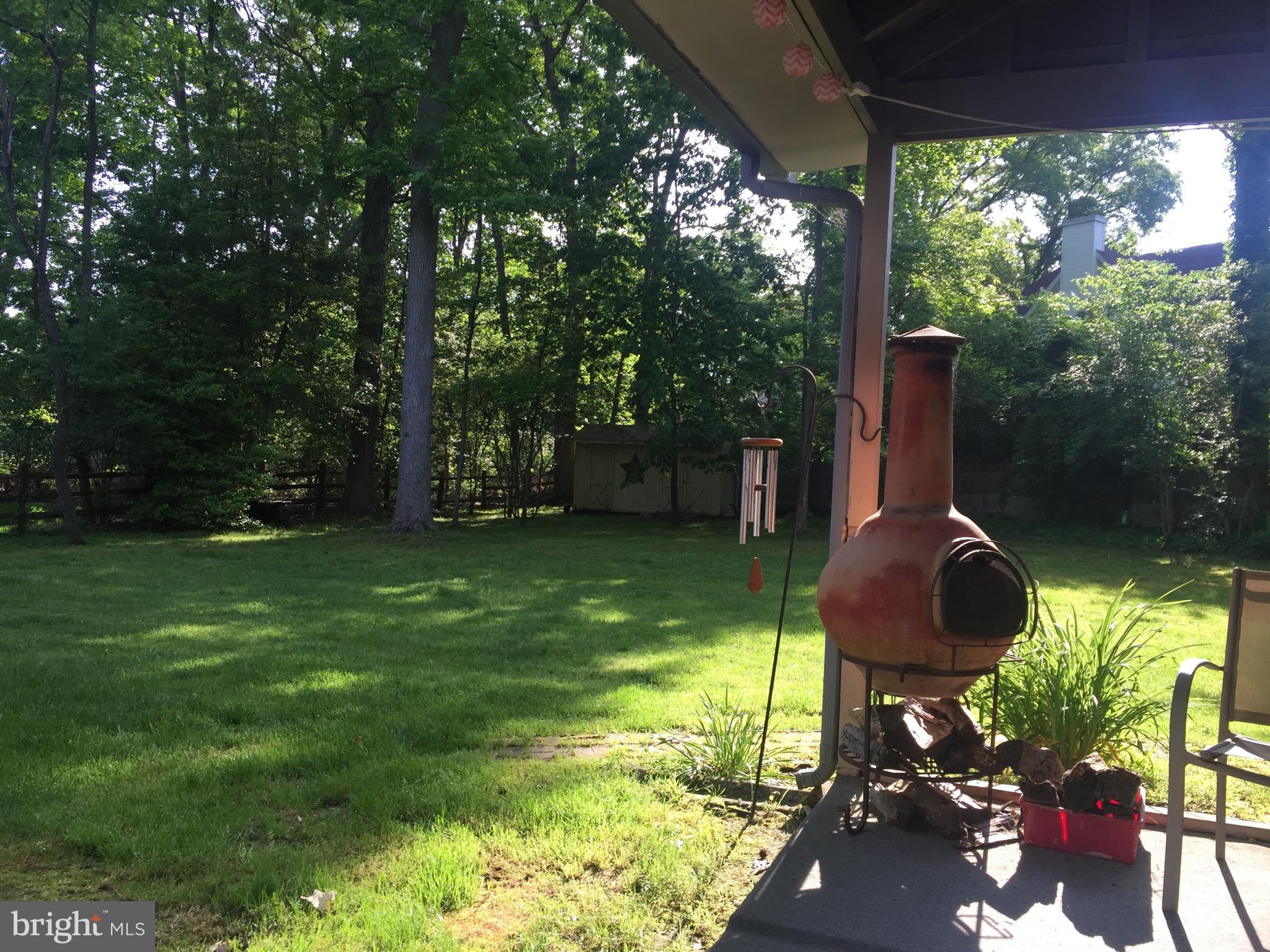 26 Whitby Road Cherry Hill, NJ 08003 - Photo 27 of 31 Rear covered patio in summer