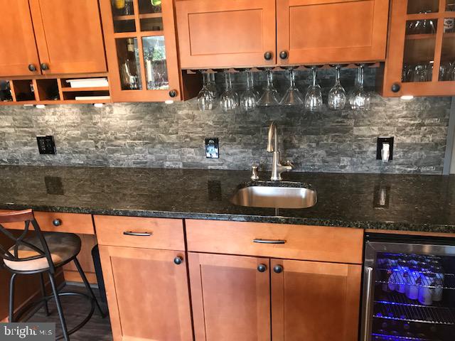26 Whitby Road Cherry Hill, NJ 08003 - Photo 6 of 31 Wet bar/ wine rack and frig in Kitchen