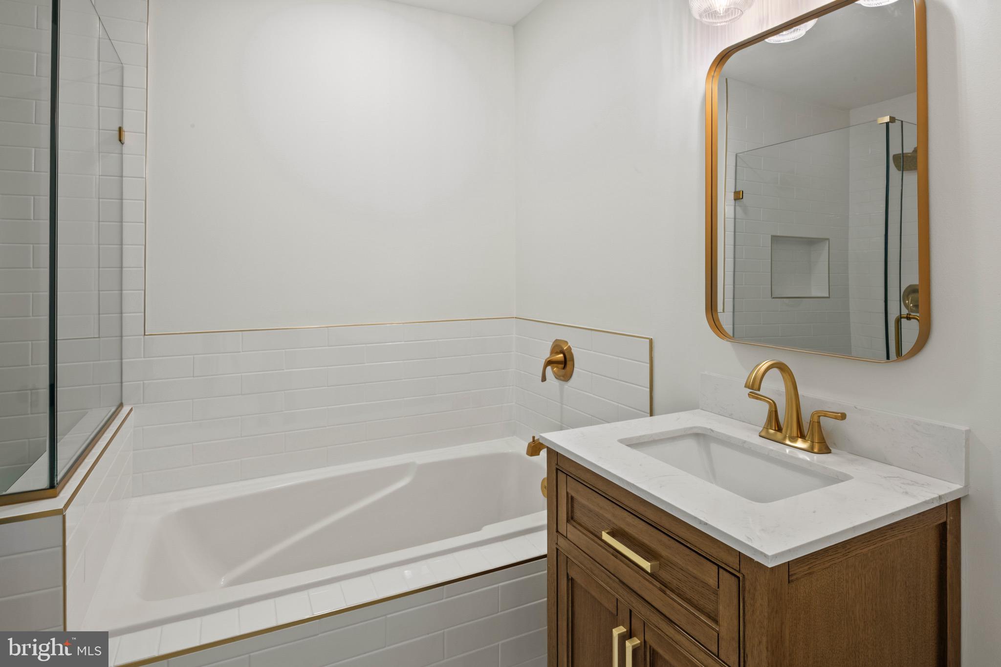 6412 Wind Rider Way Columbia, MD 21045 - Photo 15 of 37 a bathroom with a sink and a bathtub