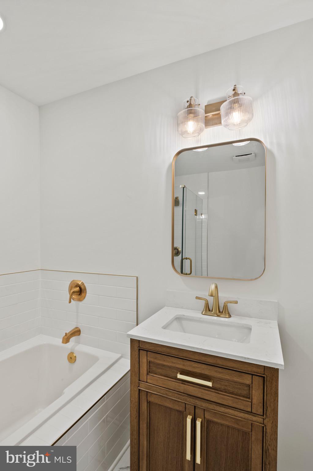 6412 Wind Rider Way Columbia, MD 21045 - Photo 16 of 37 a bathroom with a sink and a mirror