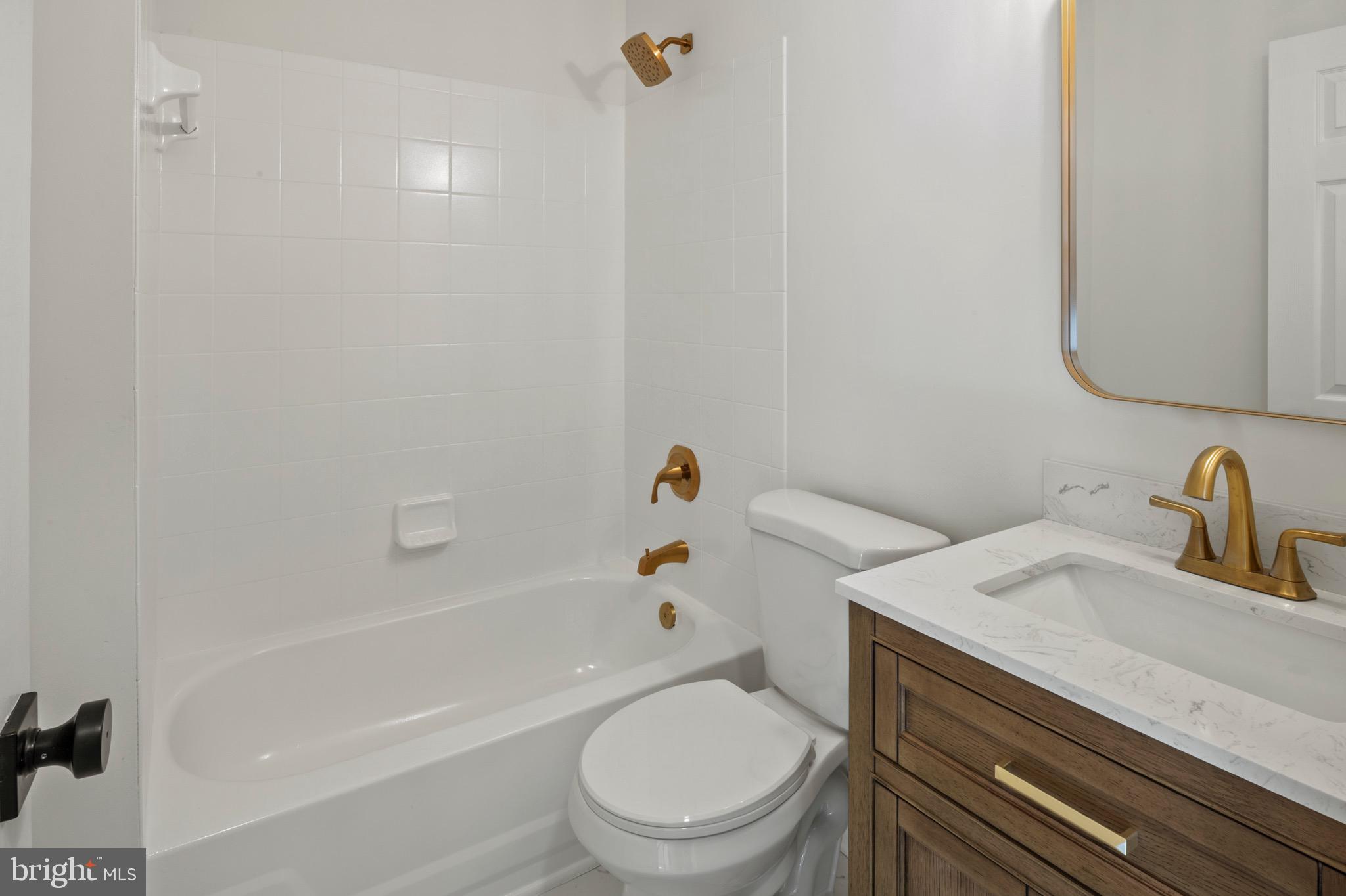 6412 Wind Rider Way Columbia, MD 21045 - Photo 23 of 37 a bathroom with a sink a toilet and shower