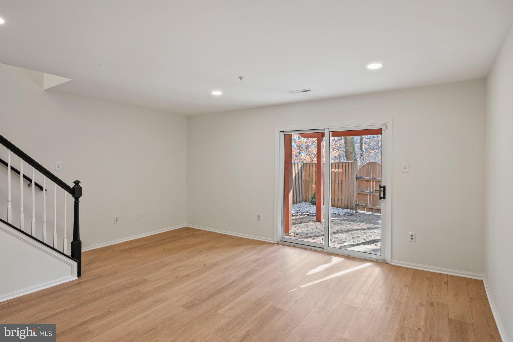 6412 Wind Rider Way Columbia, MD 21045 - Photo 24 of 37 wooden floor in an empty room with a window