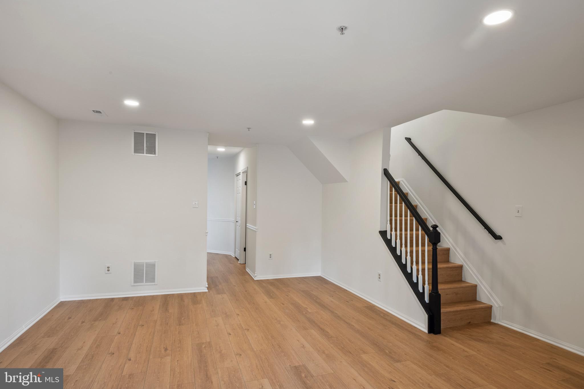 6412 Wind Rider Way Columbia, MD 21045 - Photo 25 of 37 a view of a hallway with wooden floor