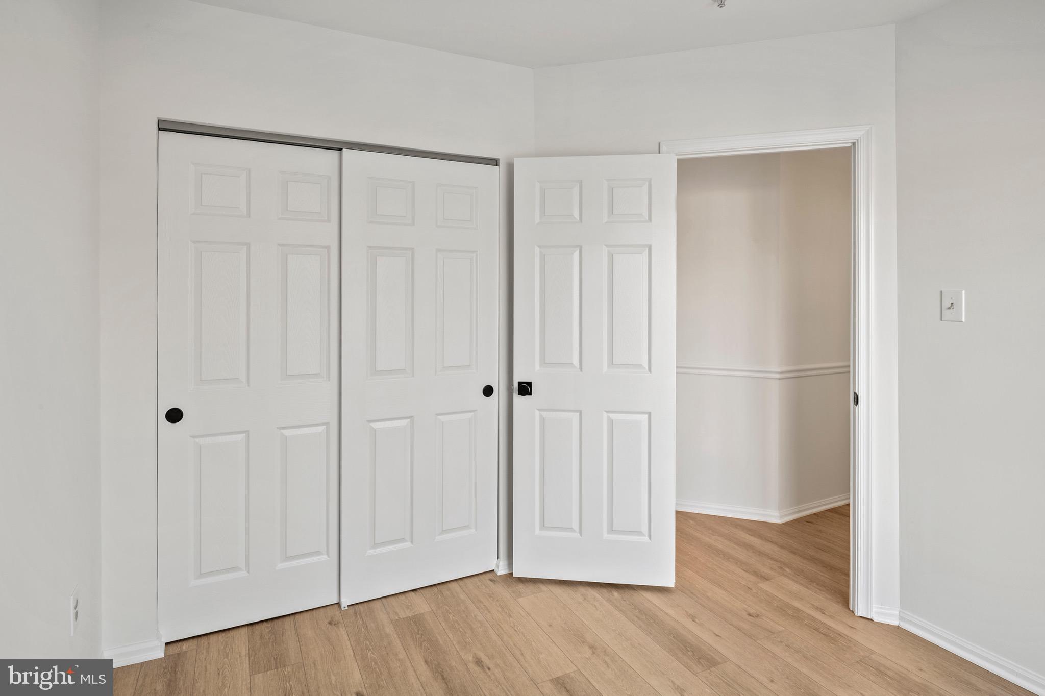 6412 Wind Rider Way Columbia, MD 21045 - Photo 27 of 37 a view of an empty room with wooden floor