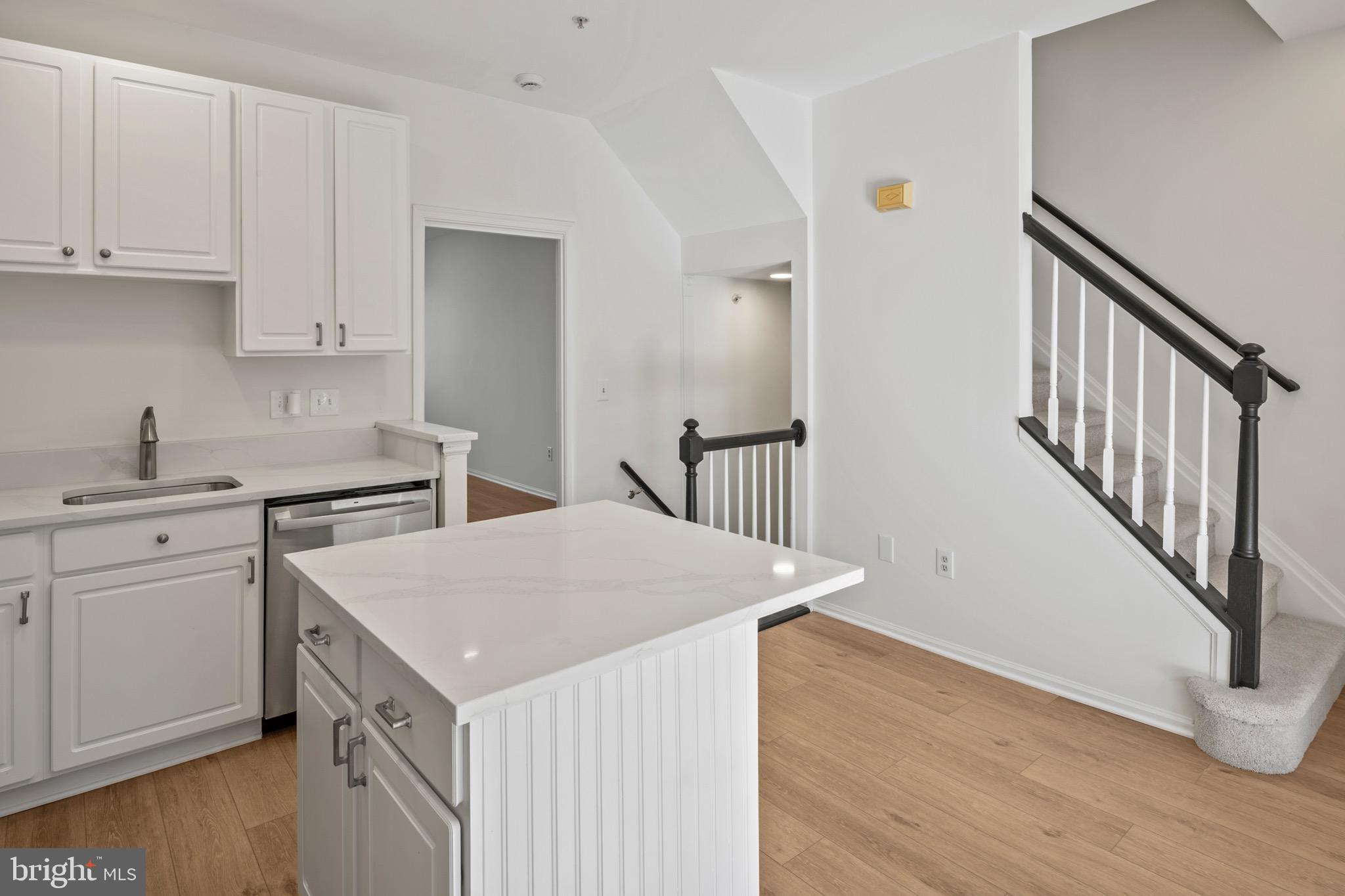 6412 Wind Rider Way Columbia, MD 21045 - Photo 4 of 37 a kitchen that has a sink and a stove in it