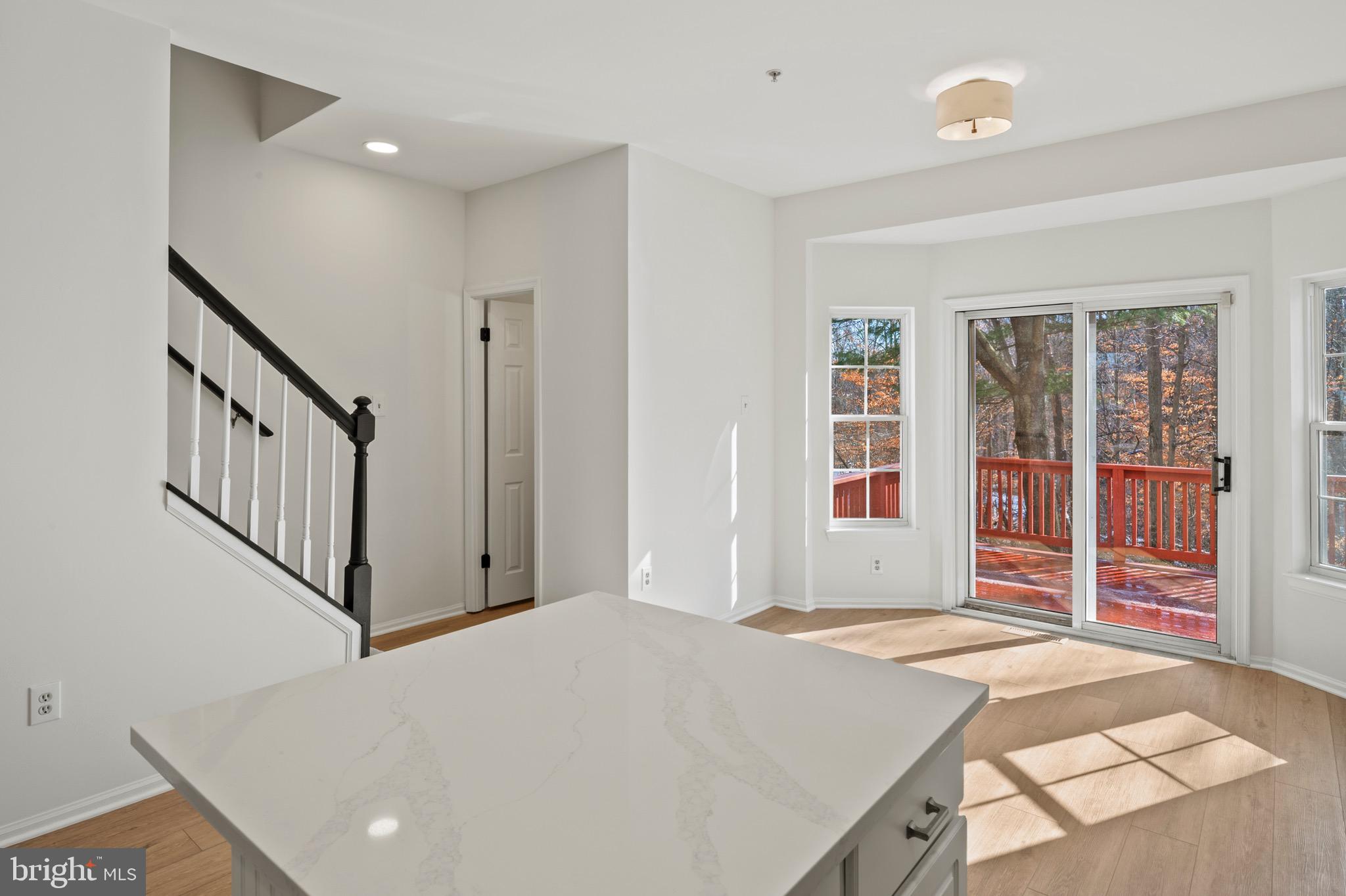 6412 Wind Rider Way Columbia, MD 21045 - Photo 6 of 37 a bedroom with a bed and wooden floor