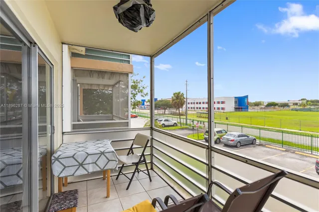 a view of a balcony with chairs