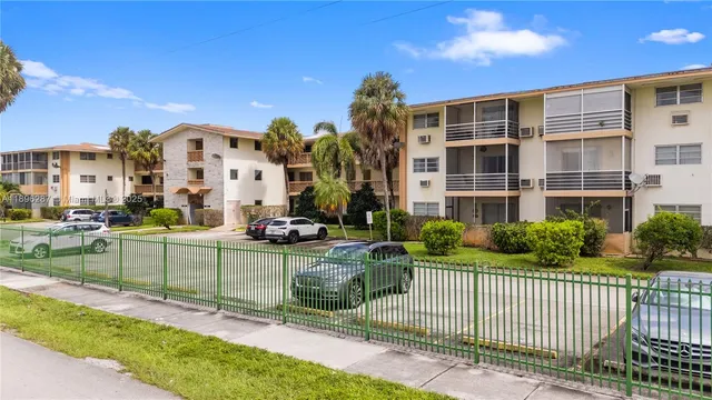 a view of a building and a yard