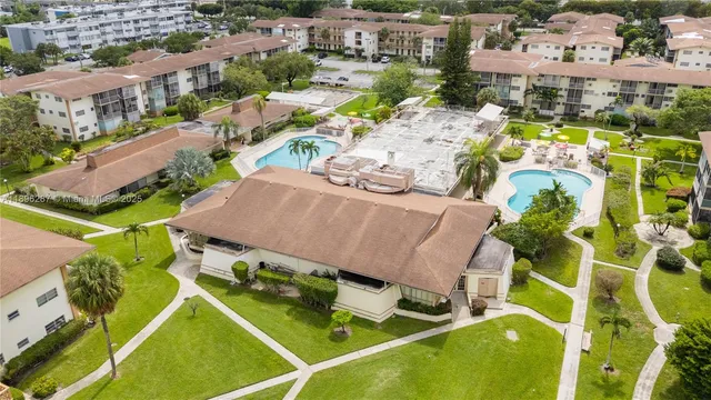 an aerial view of a house with a swimming pool
