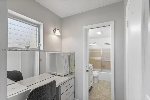 a bedroom with a bed and a walk in closet