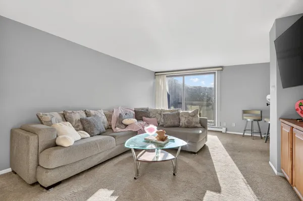 a kitchen with stainless steel appliances a refrigerator a stove and a microwave