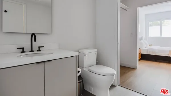 a bathroom with a sink toilet and vanity