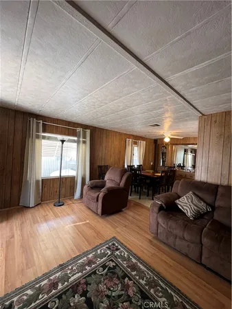 a bedroom with a bed window and couch