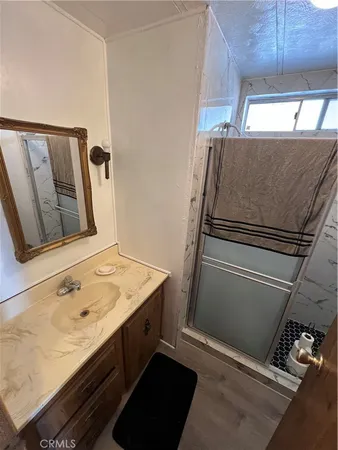 a bathroom with a sink and mirror