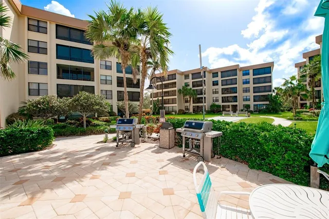 a view of a lake with a house and a yard