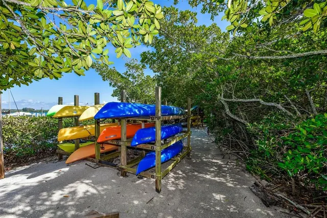 an outdoor space with lots of tables and chairs