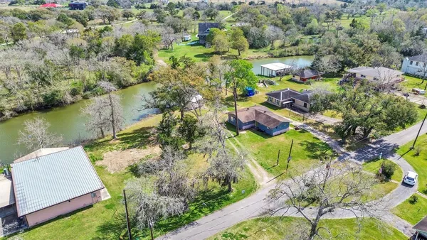 an aerial view of swimming pool playground and residential houses with outdoor space