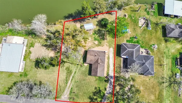 an aerial view of house with yard swimming pool and outdoor seating