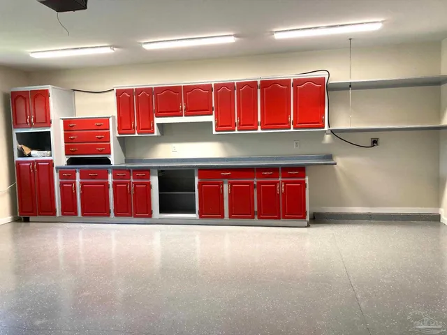 a kitchen with stainless steel appliances kitchen island granite countertop a sink counter space and cabinets