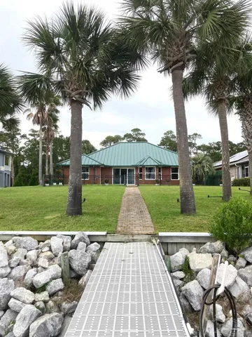 a view of backyard with green space