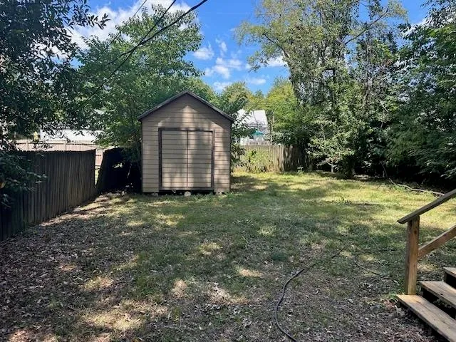 a kitchen with stainless steel appliances a refrigerator and a stove top oven
