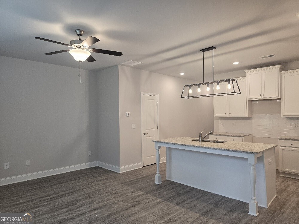 3405 Ripple Loop, Unit 127 Atlanta, GA 30349 - Photo 12 of 26 a view of a kitchen counter space a sink and dishwasher