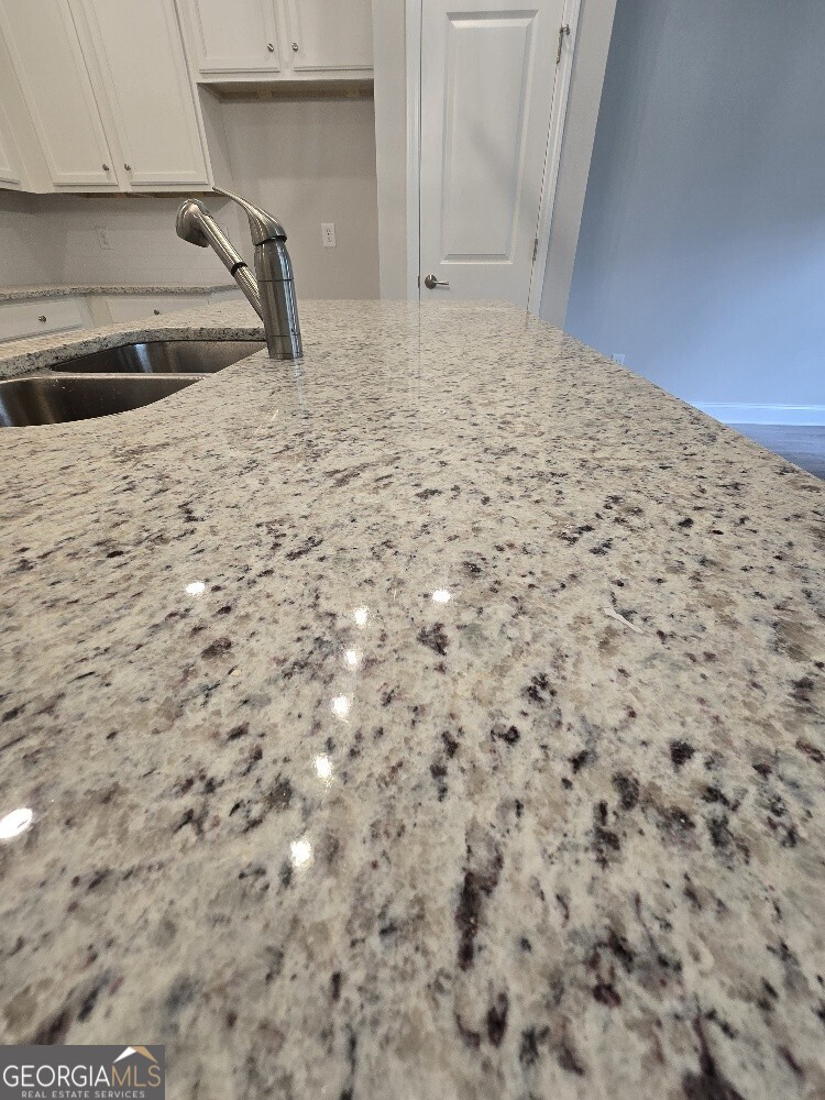 3405 Ripple Loop, Unit 127 Atlanta, GA 30349 - Photo 13 of 26 a kitchen with a sink