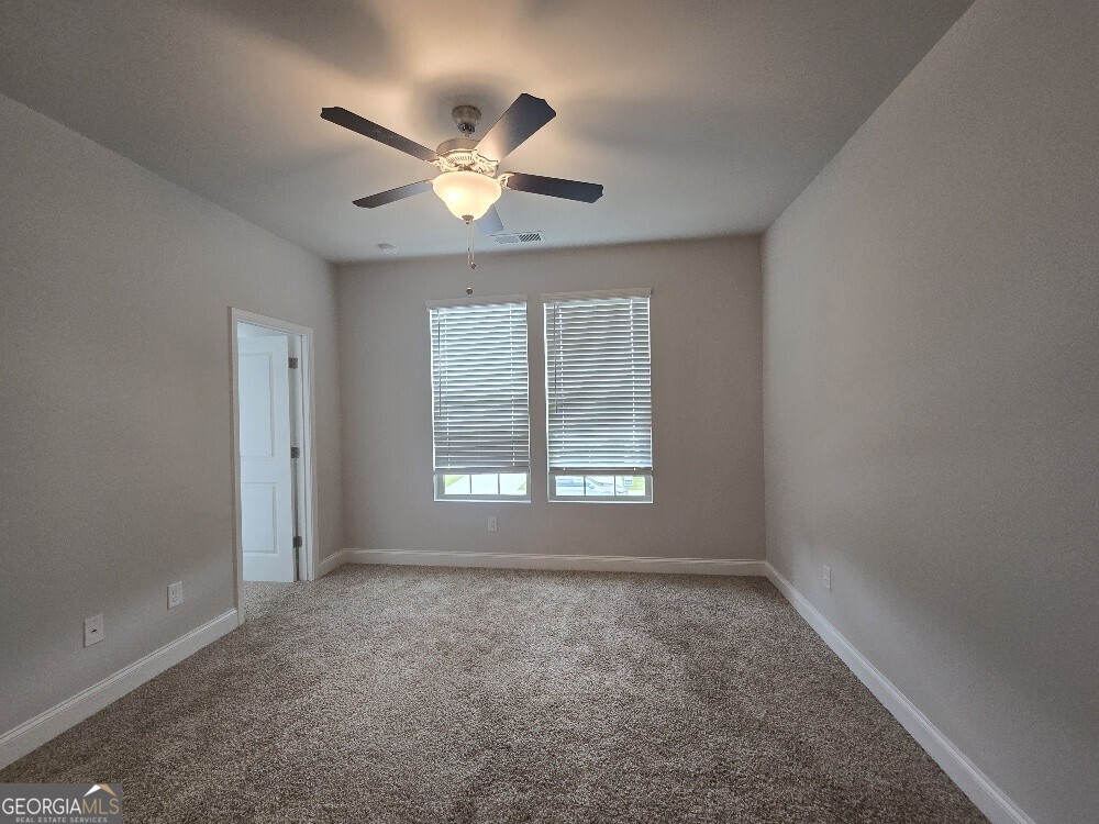 3405 Ripple Loop, Unit 127 Atlanta, GA 30349 - Photo 21 of 26 a view of an empty room with a window