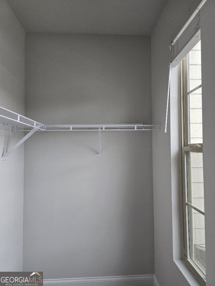 3405 Ripple Loop, Unit 127 Atlanta, GA 30349 - Photo 24 of 26 a view of an empty walk in closet