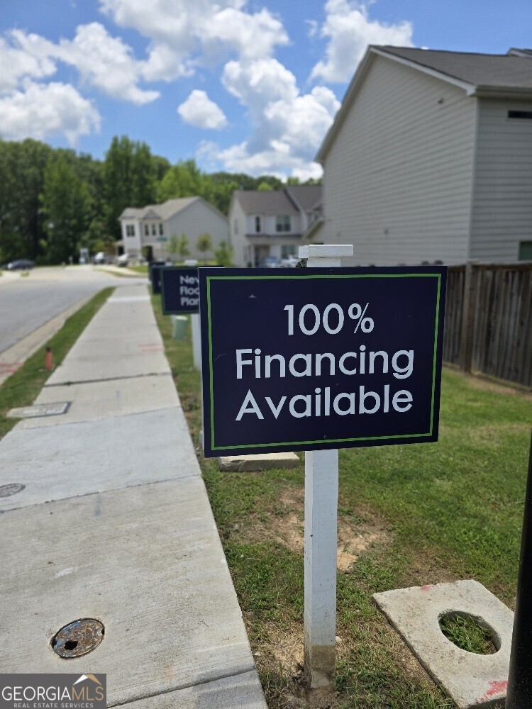 3405 Ripple Loop, Unit 127 Atlanta, GA 30349 - Photo 5 of 26 a view of a street with sign board