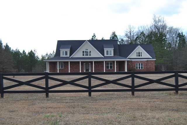 1399 Edge Road Forsyth, GA 31029 - Photo 1 of 31 a view of a house with yard and wooden fence