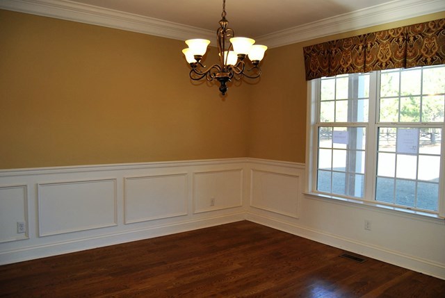 1399 Edge Road Forsyth, GA 31029 - Photo 17 of 31 a view of a room with wooden floor and chandelier