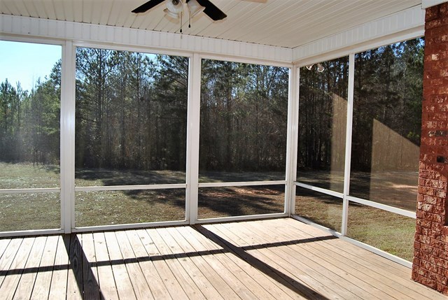 1399 Edge Road Forsyth, GA 31029 - Photo 19 of 31 a view of balcony with floor to ceiling windows with wooden floor